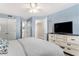 Spacious bedroom with a large TV, ample storage, and ensuite bathroom at 5523 N Ocean Blvd. # 1505, Myrtle Beach, SC 29577
