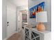 Inviting entryway features light gray vinyl floors, coastal decor, and a glimpse into the bright bedroom at 5523 N Ocean Blvd. # 1505, Myrtle Beach, SC 29577