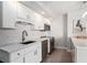 Modern kitchen featuring white cabinets, stainless steel appliances, and subway tile backsplash at 5523 N Ocean Blvd. # 1505, Myrtle Beach, SC 29577