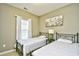 Bedroom featuring two twin beds and bright window at 5801 Oyster Catcher Dr. # 832, North Myrtle Beach, SC 29582