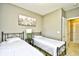 Comfortable bedroom featuring two twin beds and a window with natural light at 5801 Oyster Catcher Dr. # 832, North Myrtle Beach, SC 29582