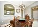 Dining area featuring a classic chandelier and pass-through to kitchen at 5801 Oyster Catcher Dr. # 832, North Myrtle Beach, SC 29582