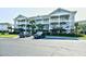 Condominium building with manicured landscaping and convenient parking at 5801 Oyster Catcher Dr. # 832, North Myrtle Beach, SC 29582