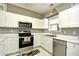 Lovely kitchen featuring stainless steel appliances and bright white cabinets at 5801 Oyster Catcher Dr. # 832, North Myrtle Beach, SC 29582