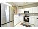 Charming kitchen featuring stainless steel appliances and bright white cabinetry at 5801 Oyster Catcher Dr. # 832, North Myrtle Beach, SC 29582