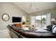 Vaulted living room with ceiling fan, sliding glass doors, and comfortable seating at 5801 Oyster Catcher Dr. # 832, North Myrtle Beach, SC 29582