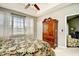 Comfortable main bedroom with ceiling fan and large window at 5801 Oyster Catcher Dr. # 832, North Myrtle Beach, SC 29582