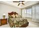 Comfortable main bedroom featuring a ceiling fan and bright window with curtains at 5801 Oyster Catcher Dr. # 832, North Myrtle Beach, SC 29582