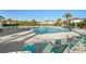 A refreshing pool surrounded by comfortable lounge chairs and swaying palm trees, perfect for relaxation and leisure at 5801 Oyster Catcher Dr. # 832, North Myrtle Beach, SC 29582