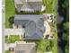 Aerial view of a home with a paved patio, manicured backyard, and waterfront access at 5904 Bridlewood Rd., North Myrtle Beach, SC 29582