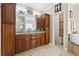 Well-appointed bathroom with dual vanities, granite countertops, and custom wood cabinets at 5904 Bridlewood Rd., North Myrtle Beach, SC 29582