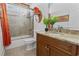 Well-lit bathroom featuring a vanity with granite countertops and a tiled shower with glass door at 5904 Bridlewood Rd., North Myrtle Beach, SC 29582