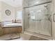 Bright bathroom featuring a glass shower and separate tub, offering a spa-like experience at 5904 Bridlewood Rd., North Myrtle Beach, SC 29582