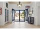 Foyer with tiled floor, double front doors, and view of the neighborhood at 5904 Bridlewood Rd., North Myrtle Beach, SC 29582