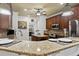 Gourmet kitchen showcasing granite counters, stainless appliances, custom cabinets and center island at 5904 Bridlewood Rd., North Myrtle Beach, SC 29582