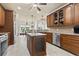 Spacious kitchen with an island, stainless steel appliances, and custom wood cabinets at 5904 Bridlewood Rd., North Myrtle Beach, SC 29582