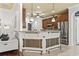 Open concept kitchen features a breakfast bar, granite countertops, and stainless steel appliances at 5904 Bridlewood Rd., North Myrtle Beach, SC 29582