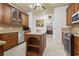Well-equipped kitchen boasts granite countertops, custom wood cabinets, and a convenient center island at 5904 Bridlewood Rd., North Myrtle Beach, SC 29582