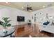 Open-concept living room with hardwood floors, neutral decor, and views into the front entry at 5904 Bridlewood Rd., North Myrtle Beach, SC 29582
