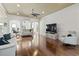Spacious living room featuring hardwood floors, neutral paint, ample natural light, and modern furnishings at 5904 Bridlewood Rd., North Myrtle Beach, SC 29582