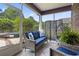 Cozy screened patio with comfortable seating, privacy screen, and serene outdoor views at 5904 Bridlewood Rd., North Myrtle Beach, SC 29582