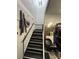 Industrial-style staircase with metal accents and durable steps, provides access to upper levels at 5904 Bridlewood Rd., North Myrtle Beach, SC 29582