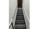 Modern staircase with metal handrail and durable steps, providing access to upper levels at 5904 Bridlewood Rd., North Myrtle Beach, SC 29582