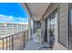 Balcony with outdoor seating with view of the adjacent resort buildings at 5905 S Kings Hwy. # 416 A, Myrtle Beach, SC 29575