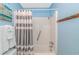 Bathroom with shower, grab bar and gray striped shower curtain at 5905 S Kings Hwy. # 416 A, Myrtle Beach, SC 29575