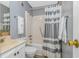 Bathroom featuring a shower and tub combination and a vanity sink with a toilet at 5905 S Kings Hwy. # 416 A, Myrtle Beach, SC 29575