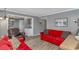 Inviting living area with red sofas, wood-style floors, and combined dining and kitchen space at 5905 S Kings Hwy. # 416 A, Myrtle Beach, SC 29575