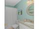 Bathroom with shower featuring a modern vanity, granite countertops, and beachy accents at 650 Tupelo Ln. # 5-F, Longs, SC 29568