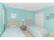 Bright bedroom featuring twin beds, closet space, and warm lighting for a comfortable retreat at 650 Tupelo Ln. # 5-F, Longs, SC 29568