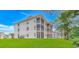 Building exterior with screened in balconies and expansive grass area at 650 Tupelo Ln. # 5-F, Longs, SC 29568