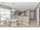 Cozy dining area with a round table, kitchen view, and natural light from the adjacent window at 650 Tupelo Ln. # 5-F, Longs, SC 29568