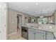 Kitchen featuring gray cabinets, stainless steel appliances, and granite countertops with breakfast bar at 650 Tupelo Ln. # 5-F, Longs, SC 29568