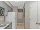 Kitchen with granite countertops, white appliances, and access to a laundry room at 650 Tupelo Ln. # 5-F, Longs, SC 29568