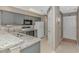 Kitchen boasts granite countertops, gray cabinets, and a full suite of appliances at 650 Tupelo Ln. # 5-F, Longs, SC 29568