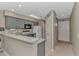 Kitchen area featuring gray cabinets, stainless appliances, and a convenient breakfast bar at 650 Tupelo Ln. # 5-F, Longs, SC 29568