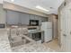 Bright kitchen featuring stainless steel appliances, granite counters, and stylish gray cabinetry at 650 Tupelo Ln. # 5-F, Longs, SC 29568