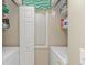 Practical laundry room with washer, dryer, storage shelves and natural light at 650 Tupelo Ln. # 5-F, Longs, SC 29568