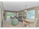 Bright living room with a comfortable sofa, dining area, and natural light at 650 Tupelo Ln. # 5-F, Longs, SC 29568