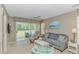 Comfortable living room with a sofa, armchair, and a view to the outdoor porch area at 650 Tupelo Ln. # 5-F, Longs, SC 29568
