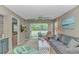 Cozy living room with a sliding glass door leading to a porch and comfortable seating area at 650 Tupelo Ln. # 5-F, Longs, SC 29568