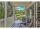 Charming patio with seating area and a view of lush green landscaping and a gazebo at 650 Tupelo Ln. # 5-F, Longs, SC 29568