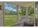 Covered porch with views of golf course and furnishings at 650 Tupelo Ln. # 5-F, Longs, SC 29568