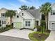 An elevated view of the home showing its landscaping, light green exterior, and one car garage at 6624 Lagoon Pl., Myrtle Beach, SC 29572