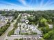 An elevated view of the community, pond, and several homes with a geolocation pin drop at 6624 Lagoon Pl., Myrtle Beach, SC 29572