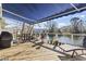Relax on the deck with a blue awning while enjoying stunning waterfront views at 6624 Lagoon Pl., Myrtle Beach, SC 29572