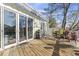 Large back deck featuring sliding glass doors to the home's interior, perfect for entertaining at 6624 Lagoon Pl., Myrtle Beach, SC 29572